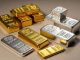 Silver, gold tumble as stronger dollar hits precious metals